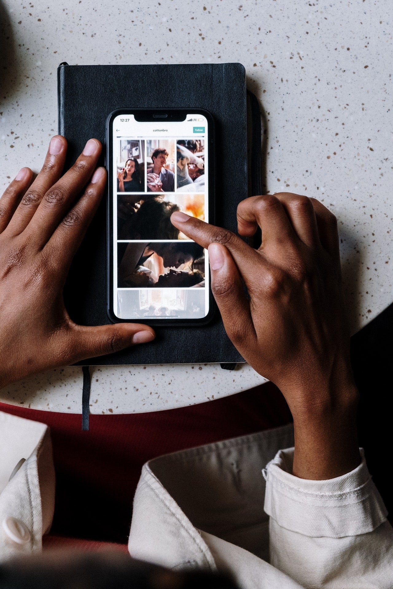 girl scrolling and picking through photos on phone