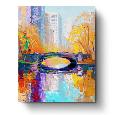 A vibrant painting of an autumn cityscape featuring colorful trees, a reflective river, and a bridge, captured in the 'Autumn Cityscape Serenity - USA' paint by numbers kit by miicreative. Perfect for enhancing mindfulness and creativity.